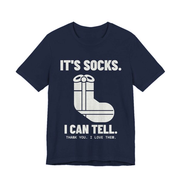 Navy t-shirt printed in off-white ink with a sock-shaped wrapped present and the words “It's Socks. I Can Tell. Thank you. I love them.”