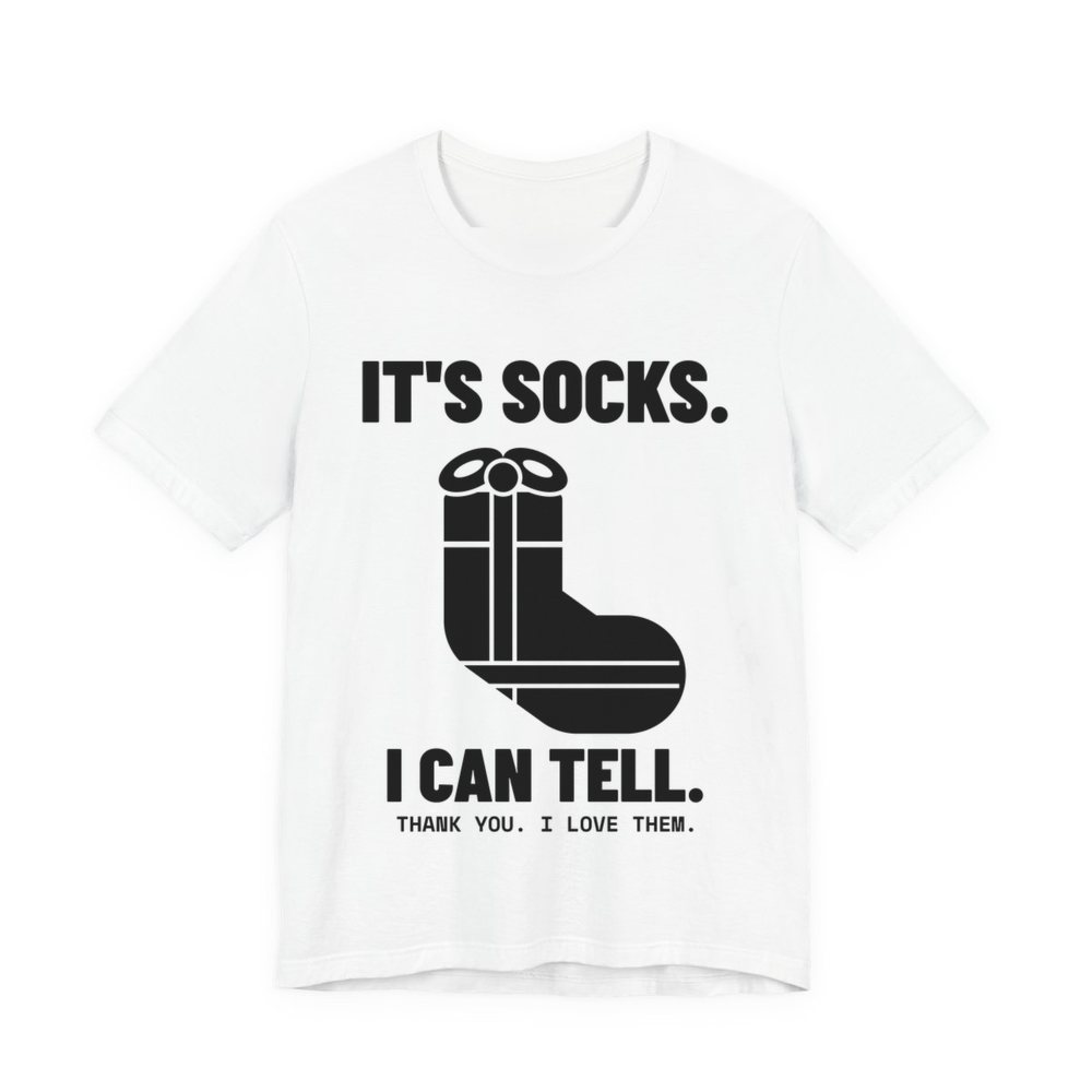 White t-shirt printed in dark ink with a sock-shaped wrapped present and the words “It's Socks. I Can Tell. Thank you. I love them.”