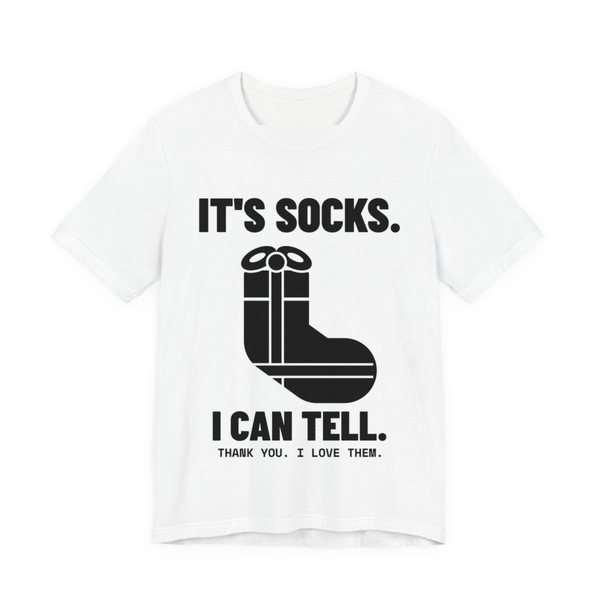 White t-shirt printed in dark ink with a sock-shaped wrapped present and the words “It's Socks. I Can Tell. Thank you. I love them.”