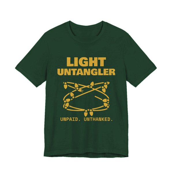 Forest t-shirt printed in gold ink with a hopelessly tangled string of Christmas lights and the words “Light Untangler. Unpaid. Unthanked.”