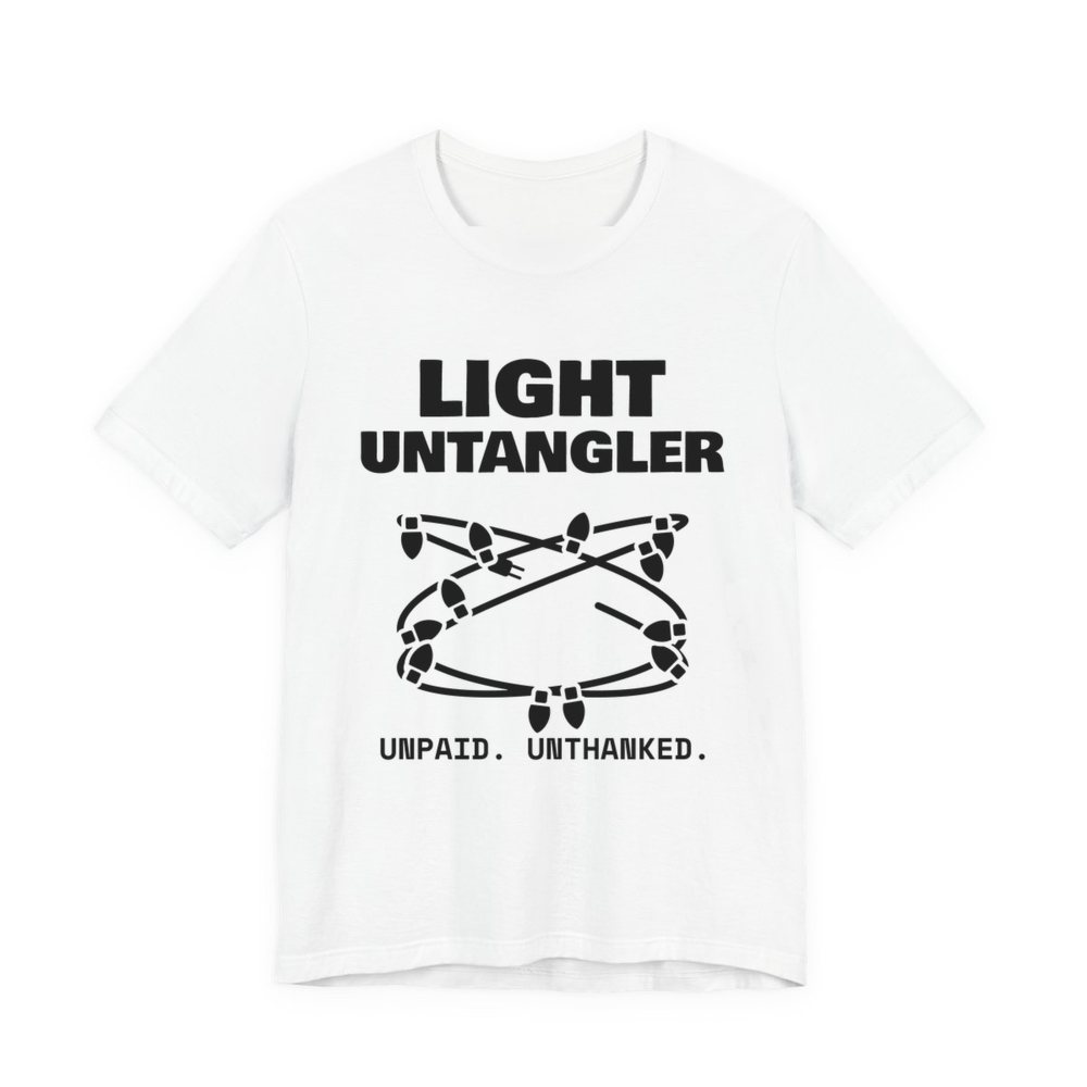 White t-shirt printed in dark ink with a hopelessly tangled string of Christmas lights and the words “Light Untangler. Unpaid. Unthanked.”