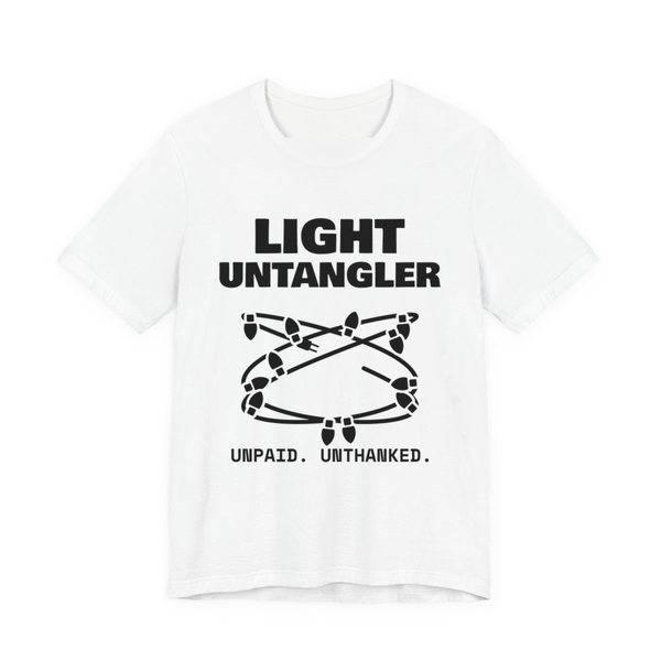 White t-shirt printed in dark ink with a hopelessly tangled string of Christmas lights and the words “Light Untangler. Unpaid. Unthanked.”