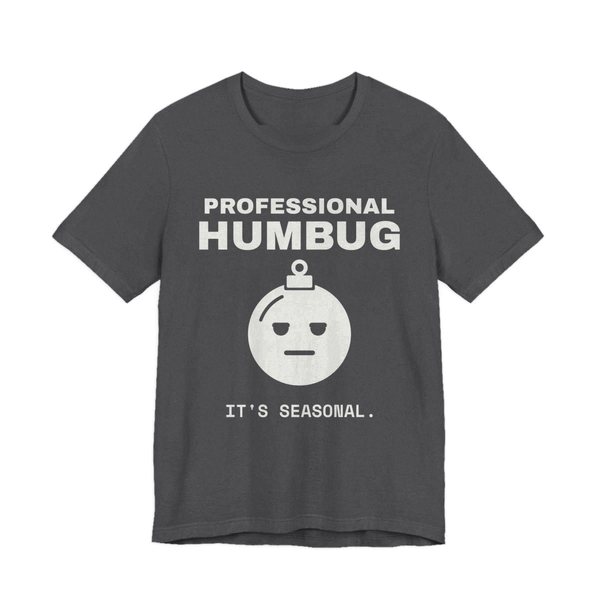 Dark Grey Heather t-shirt printed in off-white ink with an unimpressed ornament face and the words “Professional Humbug. It's Seasonal.”