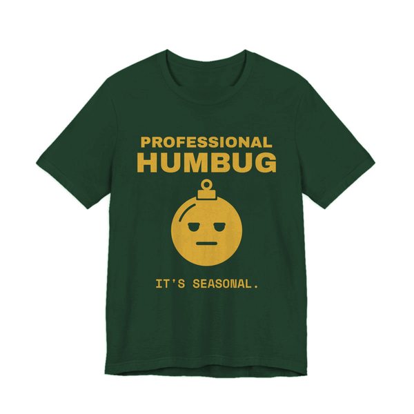Forest t-shirt printed in gold ink with an unimpressed ornament face and the words “Professional Humbug. It's Seasonal.”