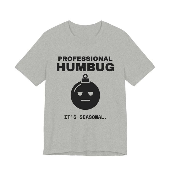 Athletic Heather t-shirt printed in dark ink with an unimpressed ornament face and the words “Professional Humbug. It's Seasonal.”
