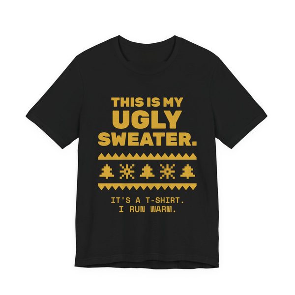 Black t-shirt printed in gold ink with a pixel-knit sweater pattern and the words “This Is My Ugly Sweater. It's a T-shirt. I run warm.”