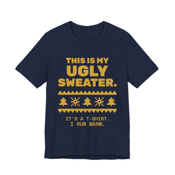 Navy t-shirt printed in gold ink with a pixel-knit sweater pattern and the words “This Is My Ugly Sweater. It's a T-shirt. I run warm.”