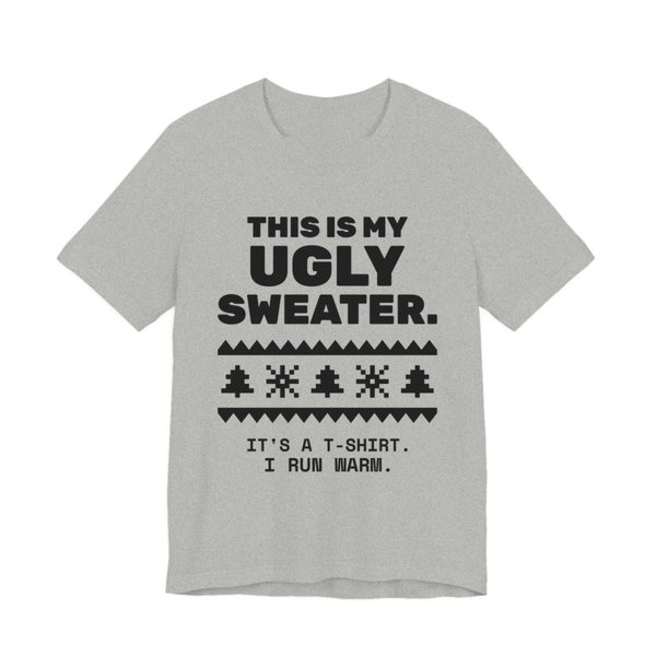 Athletic Heather t-shirt printed in dark ink with a pixel-knit sweater pattern and the words “This Is My Ugly Sweater. It's a T-shirt. I run warm.”