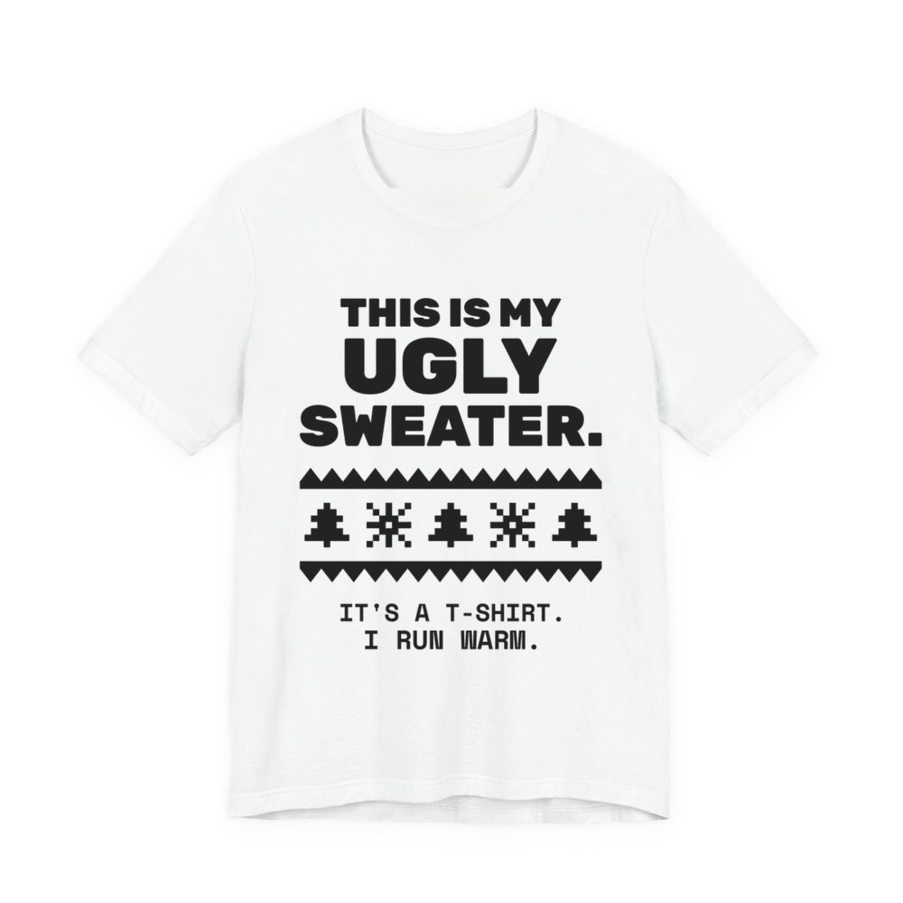 White t-shirt printed in dark ink with a pixel-knit sweater pattern and the words “This Is My Ugly Sweater. It's a T-shirt. I run warm.”