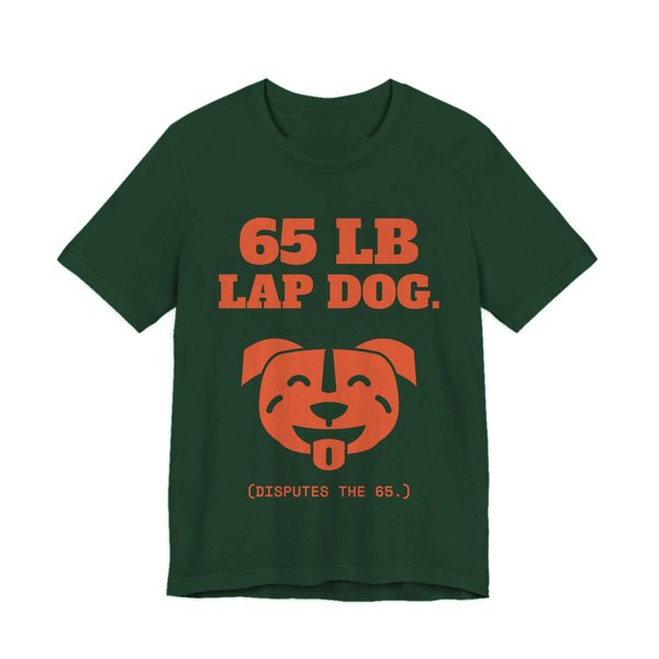 Forest t-shirt printed in orange ink with a smiling pit bull face and the words “65 lb Lap Dog. (Disputes the 65.)”