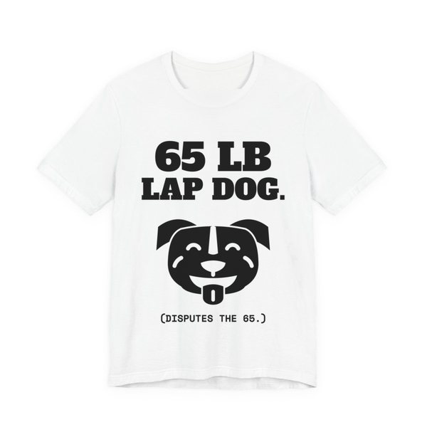 White t-shirt printed in dark ink with a smiling pit bull face and the words “65 lb Lap Dog. (Disputes the 65.)”