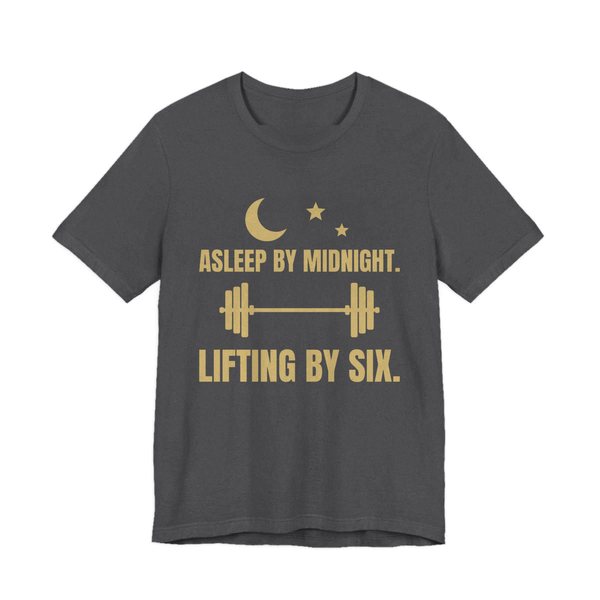 Dark Grey Heather t-shirt printed in champagne gold ink with a moon and stars, a barbell and the words “Asleep by Midnight. Lifting by Six.”