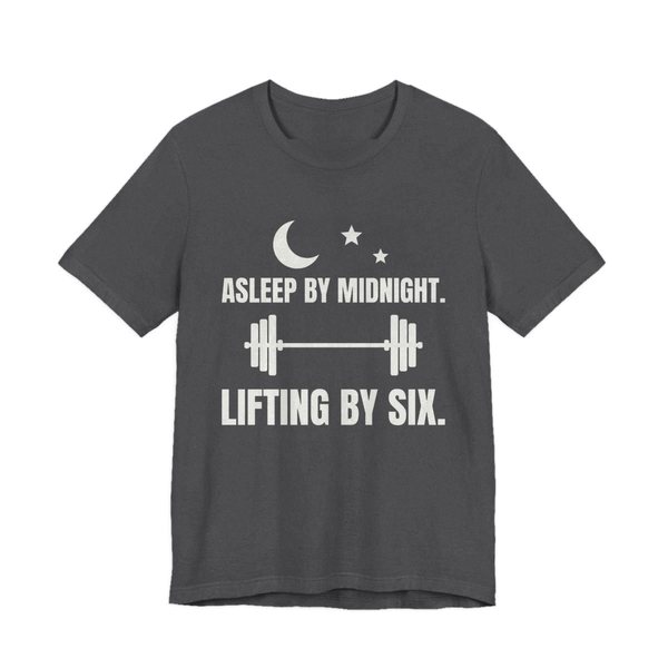 Dark Grey Heather t-shirt printed in off-white ink with a moon and stars, a barbell and the words “Asleep by Midnight. Lifting by Six.”