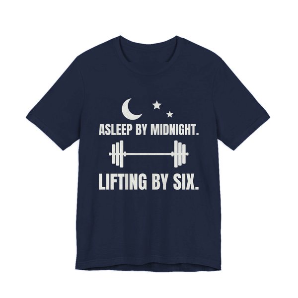 Navy t-shirt printed in off-white ink with a moon and stars, a barbell and the words “Asleep by Midnight. Lifting by Six.”