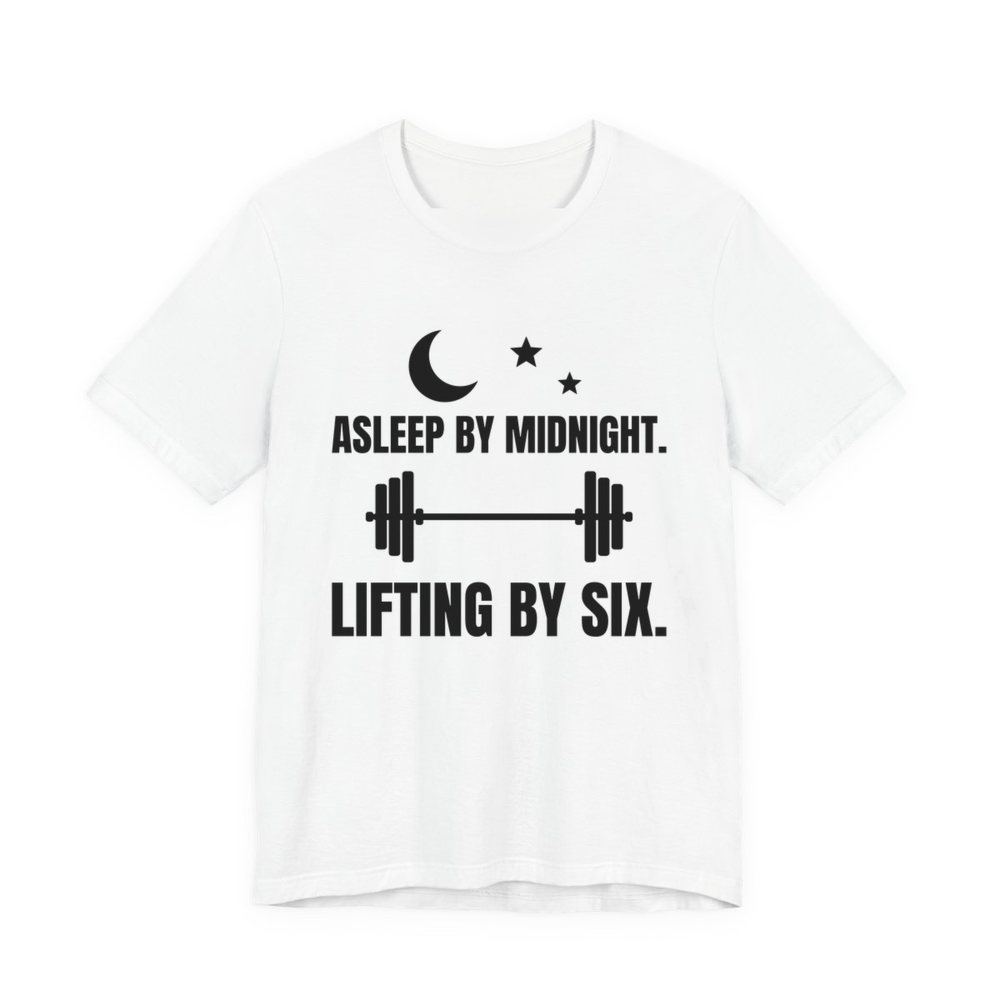 White t-shirt printed in dark ink with a moon and stars, a barbell and the words “Asleep by Midnight. Lifting by Six.”