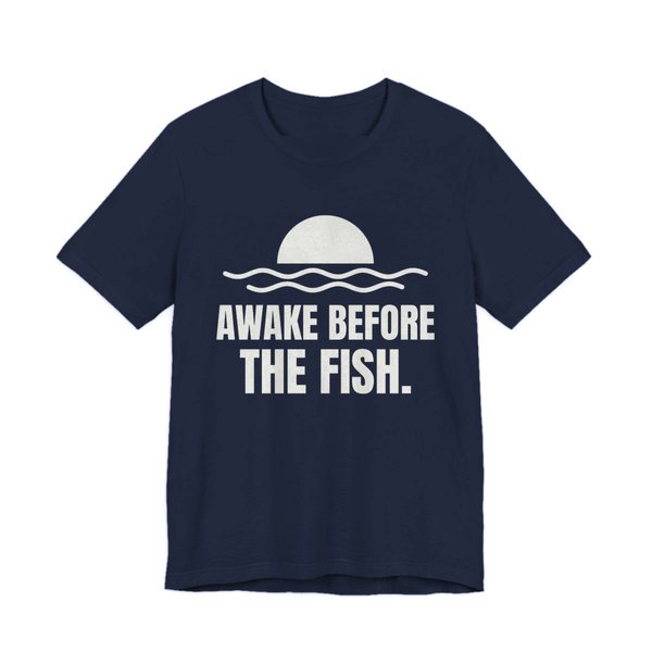 Navy t-shirt printed in off-white ink with a sun rising over the water and the words “Awake Before the Fish.”