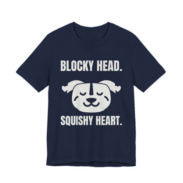 Navy t-shirt printed in off-white ink with a pit bull face with hearts and the words “Blocky Head. Squishy Heart.”