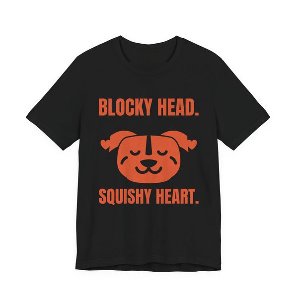 Black t-shirt printed in orange ink with a pit bull face with hearts and the words “Blocky Head. Squishy Heart.”