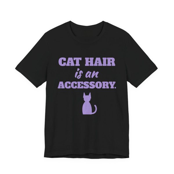 Black t-shirt printed in lavender ink with a cat silhouette and the words “Cat Hair Is an Accessory.”