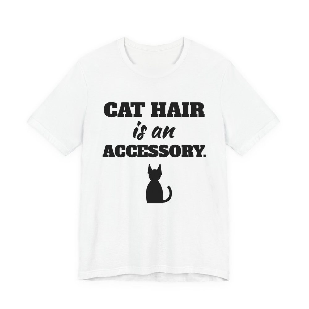 White t-shirt printed in dark ink with a cat silhouette and the words “Cat Hair Is an Accessory.”