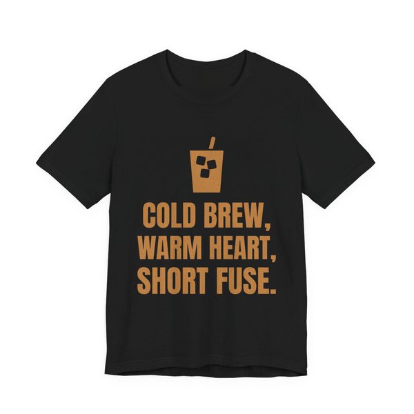 Black t-shirt printed in caramel ink with an iced coffee and the words “Cold Brew, Warm Heart, Short Fuse.”