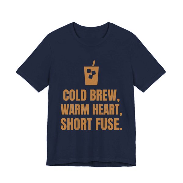 Navy t-shirt printed in caramel ink with an iced coffee and the words “Cold Brew, Warm Heart, Short Fuse.”