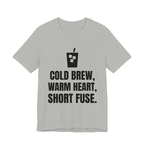 Athletic Heather t-shirt printed in dark ink with an iced coffee and the words “Cold Brew, Warm Heart, Short Fuse.”