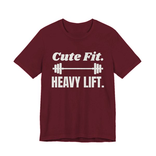 Maroon t-shirt printed in off-white ink with a barbell between the words "Cute Fit." and "Heavy Lift."