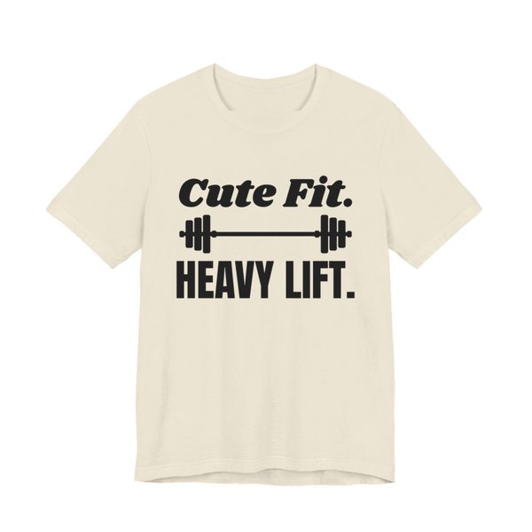 Natural t-shirt printed in dark ink with a barbell between the words "Cute Fit." and "Heavy Lift."