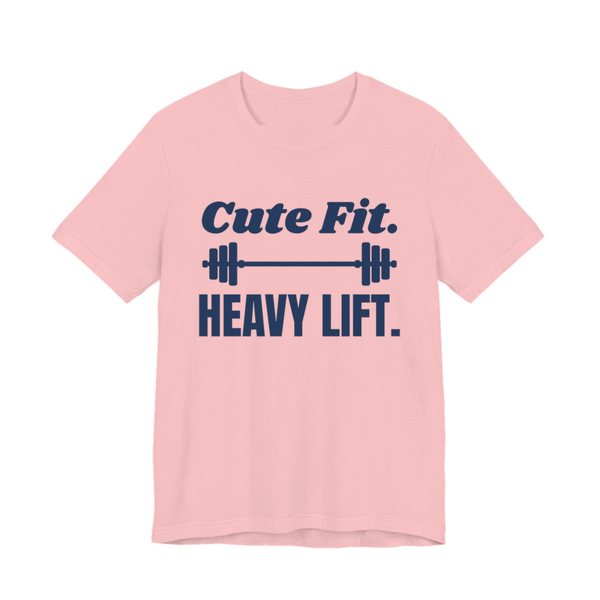 Pink t-shirt printed in navy blue ink with a barbell between the words "Cute Fit." and "Heavy Lift."