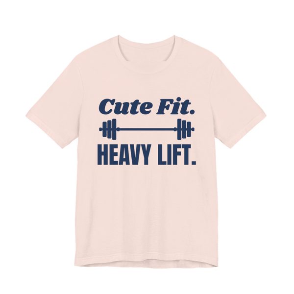 Soft Pink t-shirt printed in navy blue ink with a barbell between the words "Cute Fit." and "Heavy Lift."
