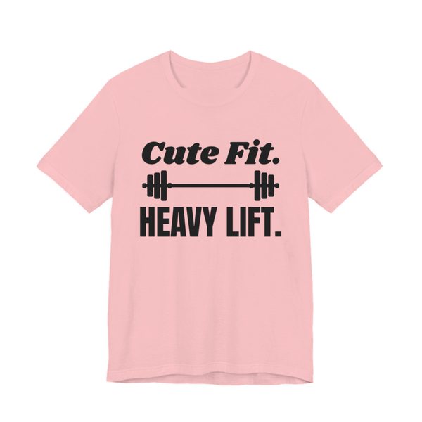 Pink t-shirt printed in dark ink with a barbell between the words "Cute Fit." and "Heavy Lift."