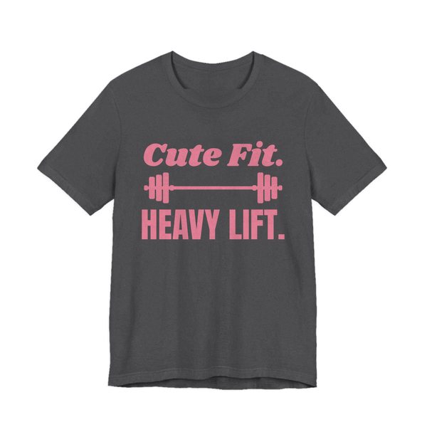Dark Grey Heather t-shirt printed in rose pink ink with a barbell between the words "Cute Fit." and "Heavy Lift."