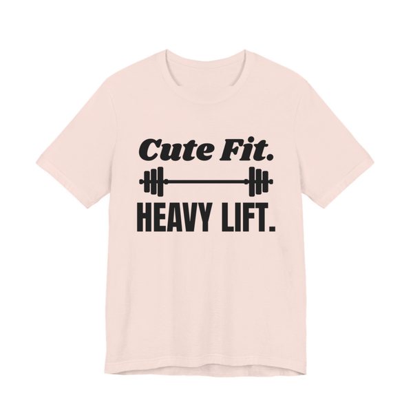 Soft Pink t-shirt printed in dark ink with a barbell between the words "Cute Fit." and "Heavy Lift."