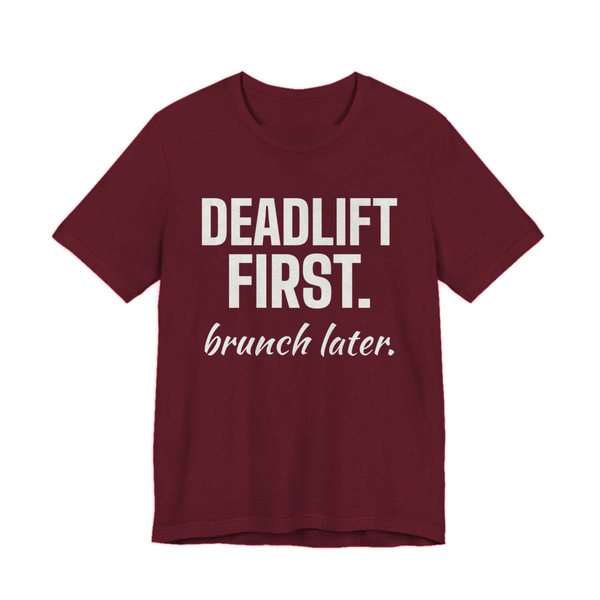 Maroon t-shirt printed in off-white ink with the words "Deadlift First. Brunch Later."
