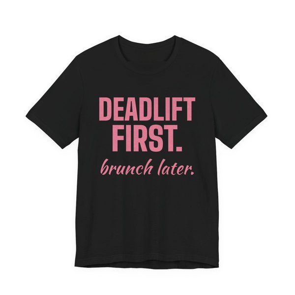 Black t-shirt printed in rose pink ink with the words "Deadlift First. Brunch Later."