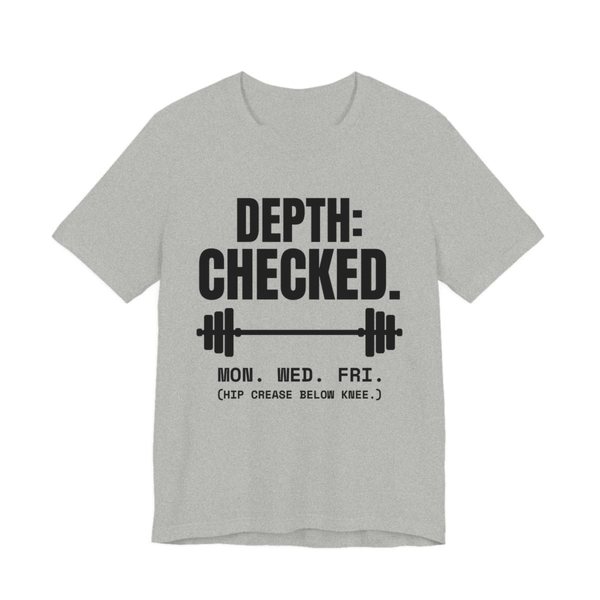 Athletic Heather t-shirt printed in dark ink with a barbell and the words “Depth: Checked. Mon. Wed. Fri. (Hip crease below knee.)”