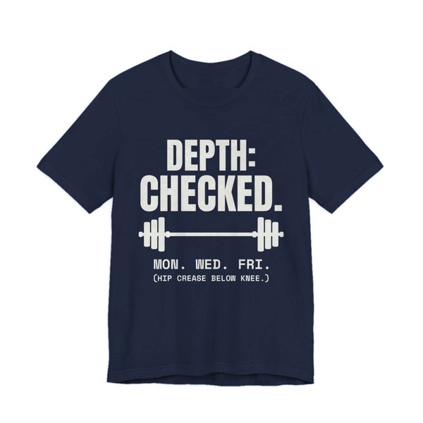 Navy t-shirt printed in off-white ink with a barbell and the words “Depth: Checked. Mon. Wed. Fri. (Hip crease below knee.)”