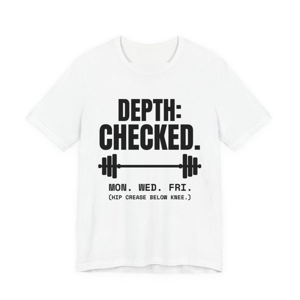White t-shirt printed in dark ink with a barbell and the words “Depth: Checked. Mon. Wed. Fri. (Hip crease below knee.)”