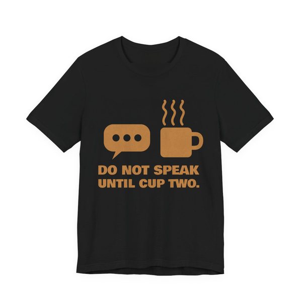 Black t-shirt printed in caramel ink with a speech bubble, a steaming mug and the words “Do Not Speak Until Cup Two.”