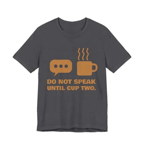 Dark Grey Heather t-shirt printed in caramel ink with a speech bubble, a steaming mug and the words “Do Not Speak Until Cup Two.”
