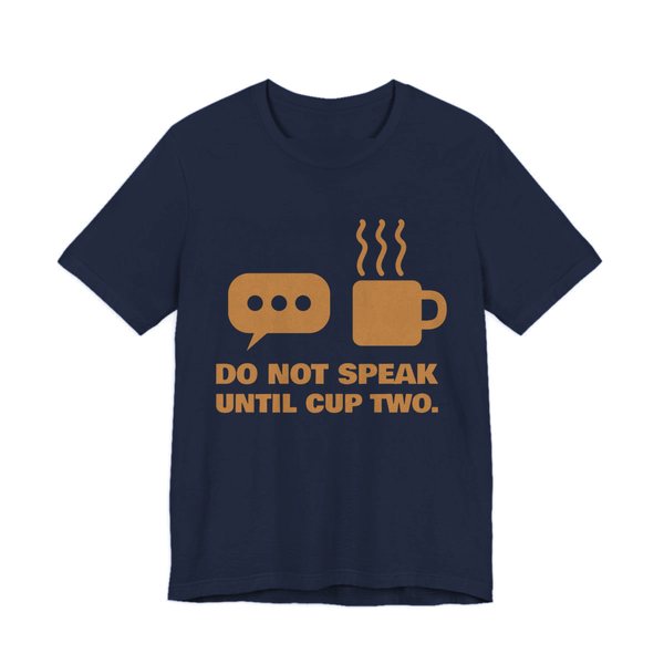 Navy t-shirt printed in caramel ink with a speech bubble, a steaming mug and the words “Do Not Speak Until Cup Two.”