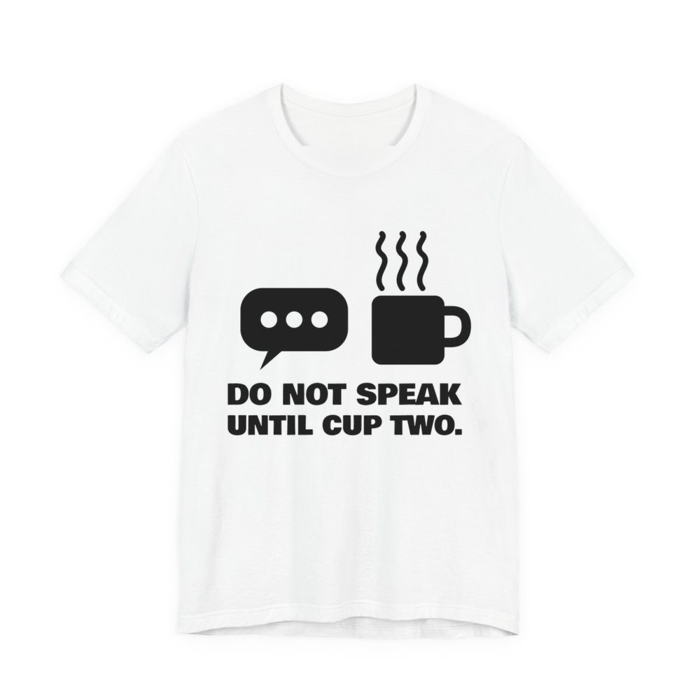 White t-shirt printed in dark ink with a speech bubble, a steaming mug and the words “Do Not Speak Until Cup Two.”
