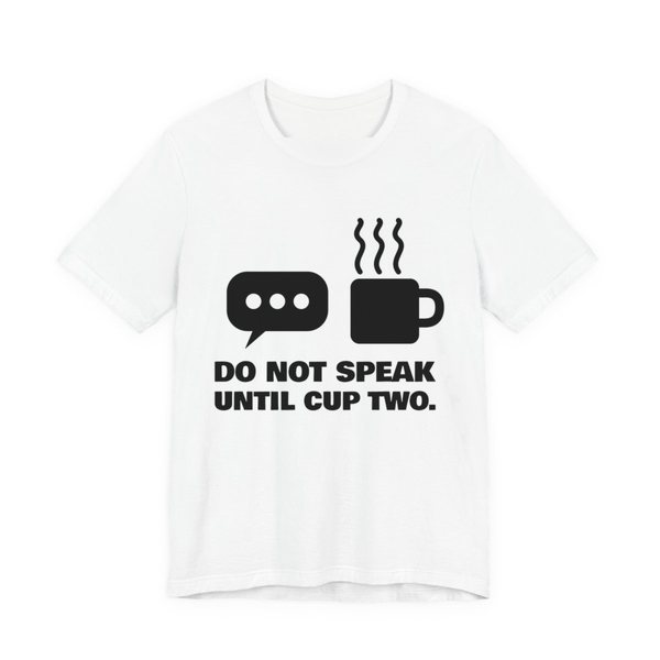 White t-shirt printed in dark ink with a speech bubble, a steaming mug and the words “Do Not Speak Until Cup Two.”
