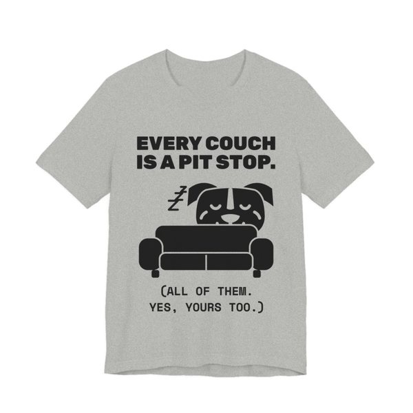 Athletic Heather t-shirt printed in dark ink with a pit bull napping on a couch and the words “Every Couch Is a Pit Stop. (All of them. Yes, yours too.)”
