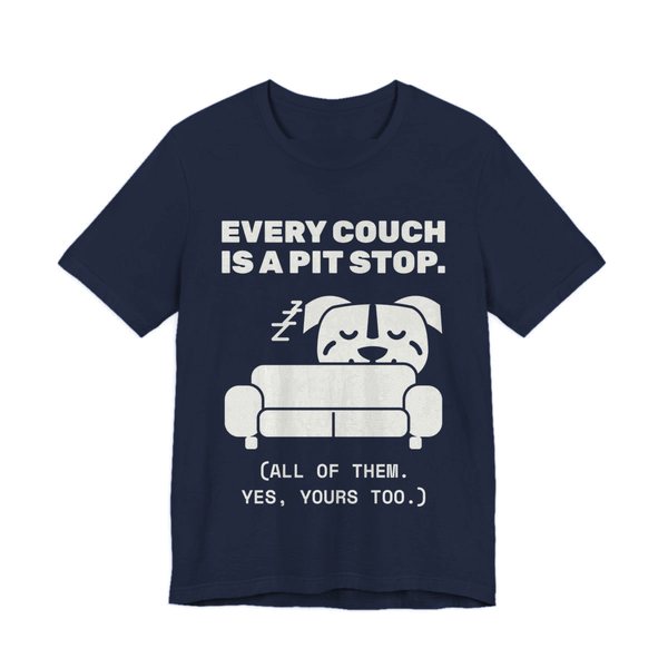 Navy t-shirt printed in off-white ink with a pit bull napping on a couch and the words “Every Couch Is a Pit Stop. (All of them. Yes, yours too.)”