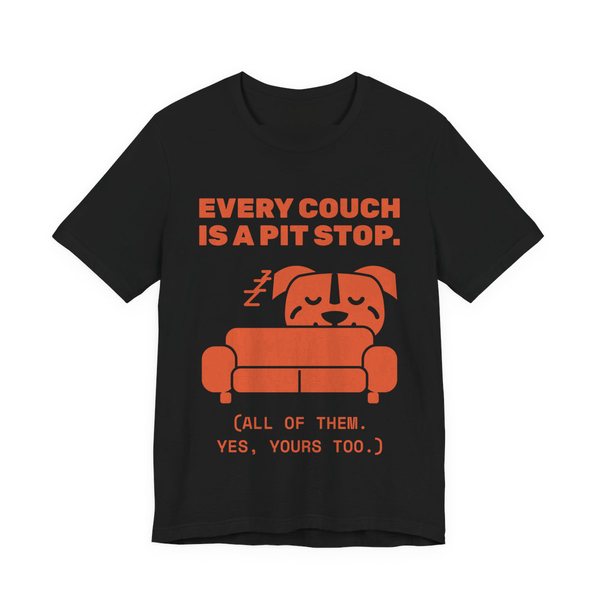 Black t-shirt printed in orange ink with a pit bull napping on a couch and the words “Every Couch Is a Pit Stop. (All of them. Yes, yours too.)”