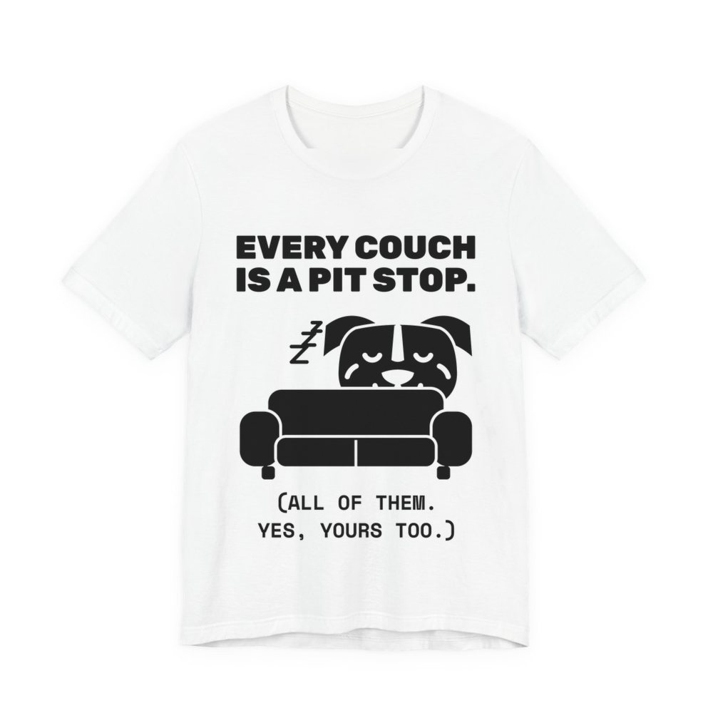 White t-shirt printed in dark ink with a pit bull napping on a couch and the words “Every Couch Is a Pit Stop. (All of them. Yes, yours too.)”