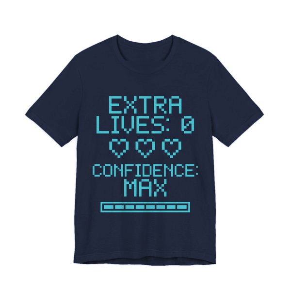 Navy t-shirt printed in cyan ink with three empty pixel hearts, a full meter and the words “Extra Lives: 0. Confidence: Max.”