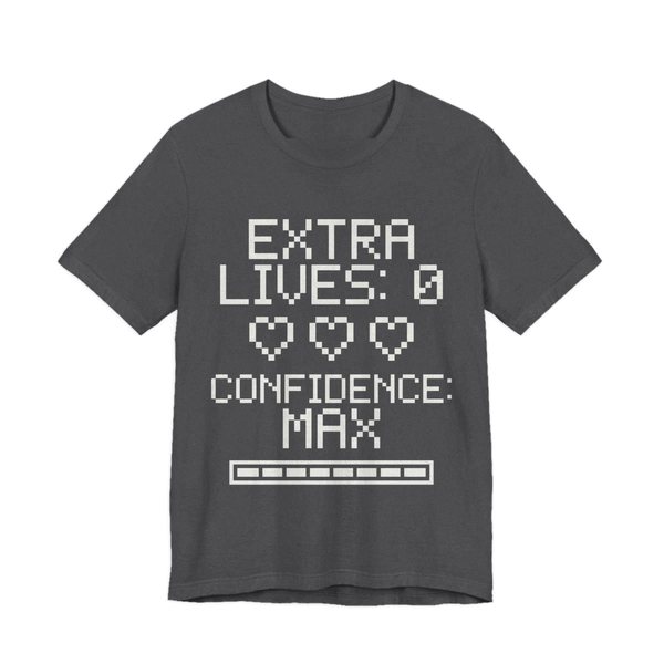 Dark Grey Heather t-shirt printed in off-white ink with three empty pixel hearts, a full meter and the words “Extra Lives: 0. Confidence: Max.”